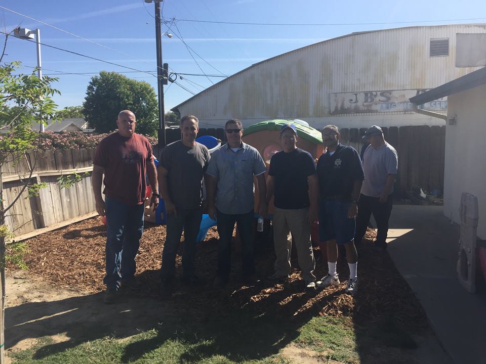 police officers gather to re-assemble play set