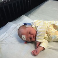A sleeping baby boy in the hospital