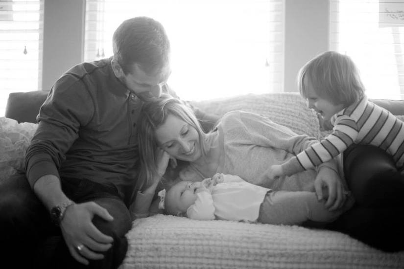 Author and her family laying on the couch together