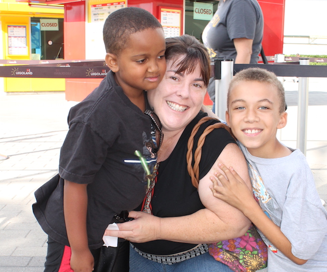 A mother with her two children. 