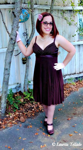 woman posing for photo next to a tree