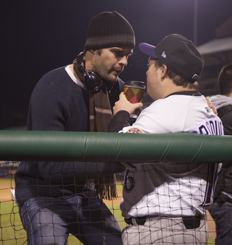 crew member talks with David on set