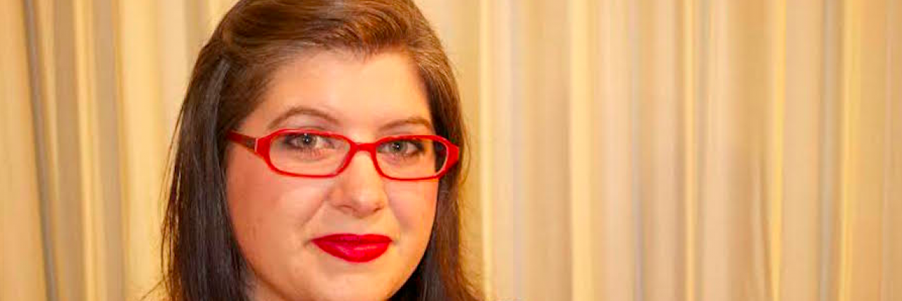 Rapid Cycling Bipolar II and Difficulty of Finding Treatment Woman with brown hair and red glasses