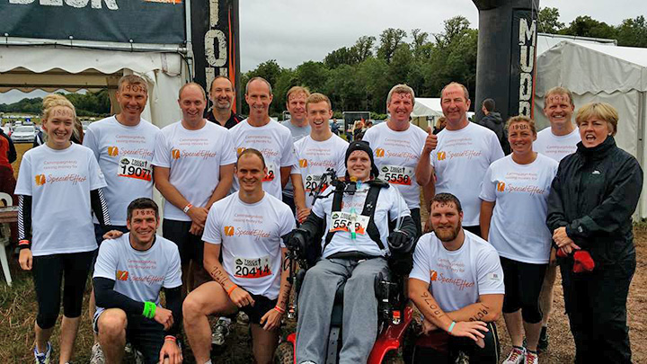 rob camm with teammates and supporters at tough mudder challenge