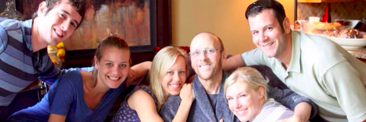 What I Want to Tell the People Who Pity Us After My Husband Passed Away Family smiling with arms around each other