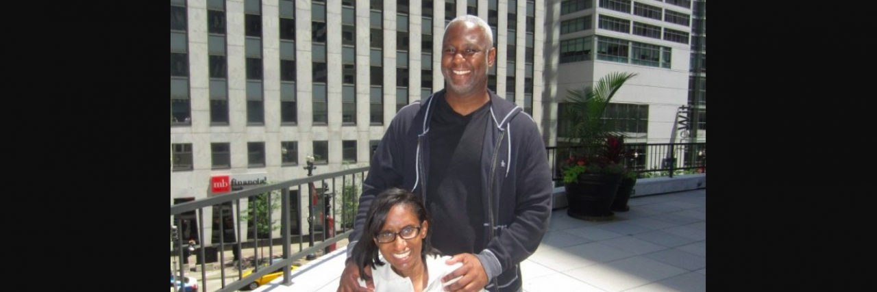 When Your Husband or Wife Has Multiple Sclerosis Black woman with her husband on a rooftop outside