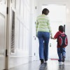 Mother and Son Walking in Hallway