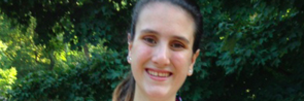 To the Woman on the Beach Who Thanked Me for Rocking a Bikini Woman poses in bikini and shows off tubes in her stomach