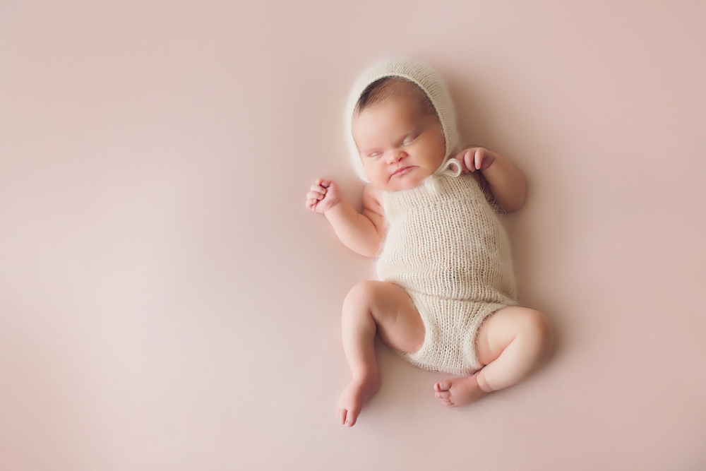 Baby Abigail on a light pink background