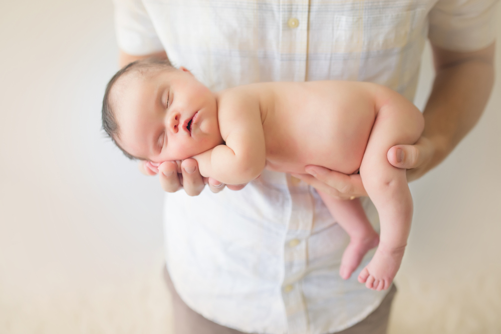 Dad holding sleeping baby daughter Abigail