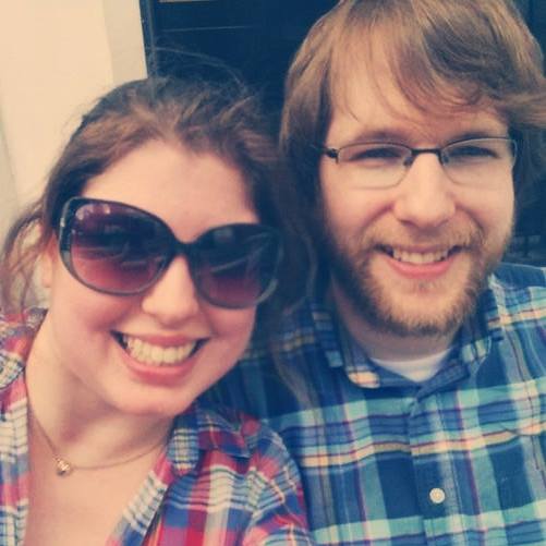 Woman wearing sunglasses next to man wearing glasses