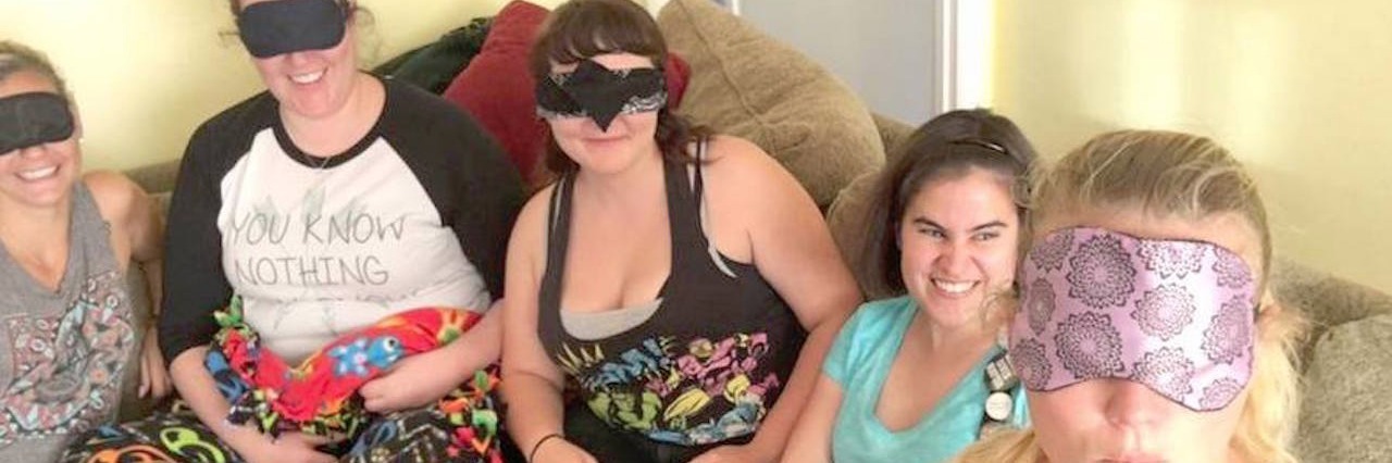 Questions I Get Asked as a Blind Person Caitlin's description of the image: "A selfie a sighted friend took when she and three other sighted friends put on blindfolds and watched a movie with me using video description."