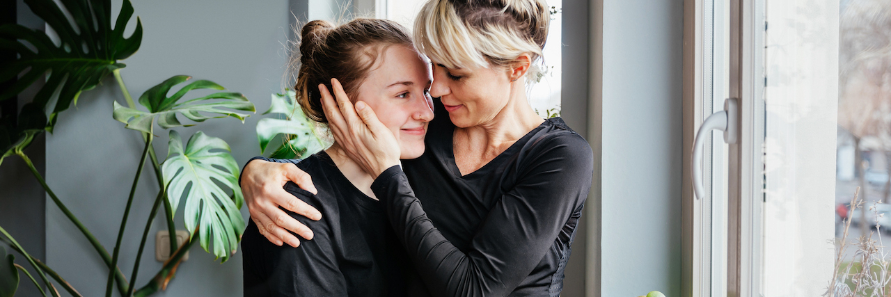 A Parent's Guide to Mental Illness in the Family A mom and her daughter hugging