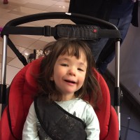 small girl in stroller