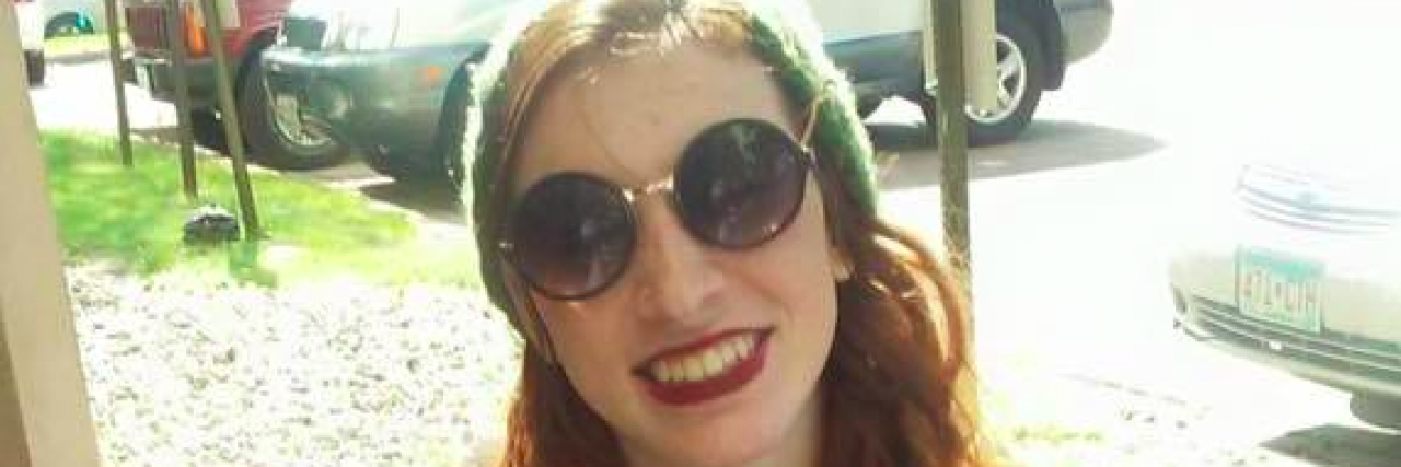 7 Things I Wish My Loved Ones Knew About Living With Disabilities Woman in a wheelchair smiling and wearing a Misfits band t-shirt