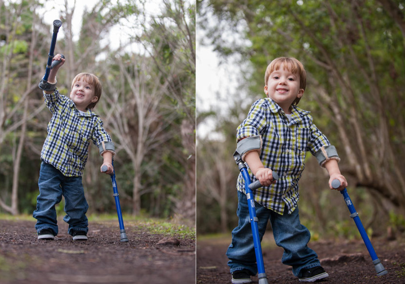 A young boy using a walker. 