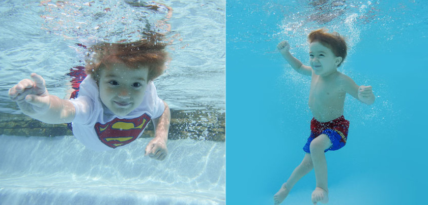 A young boy swimming. 