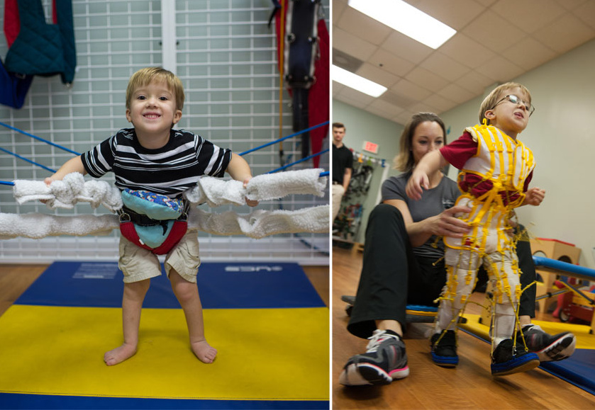 A young boy with spina bifida getting assistance walking. 