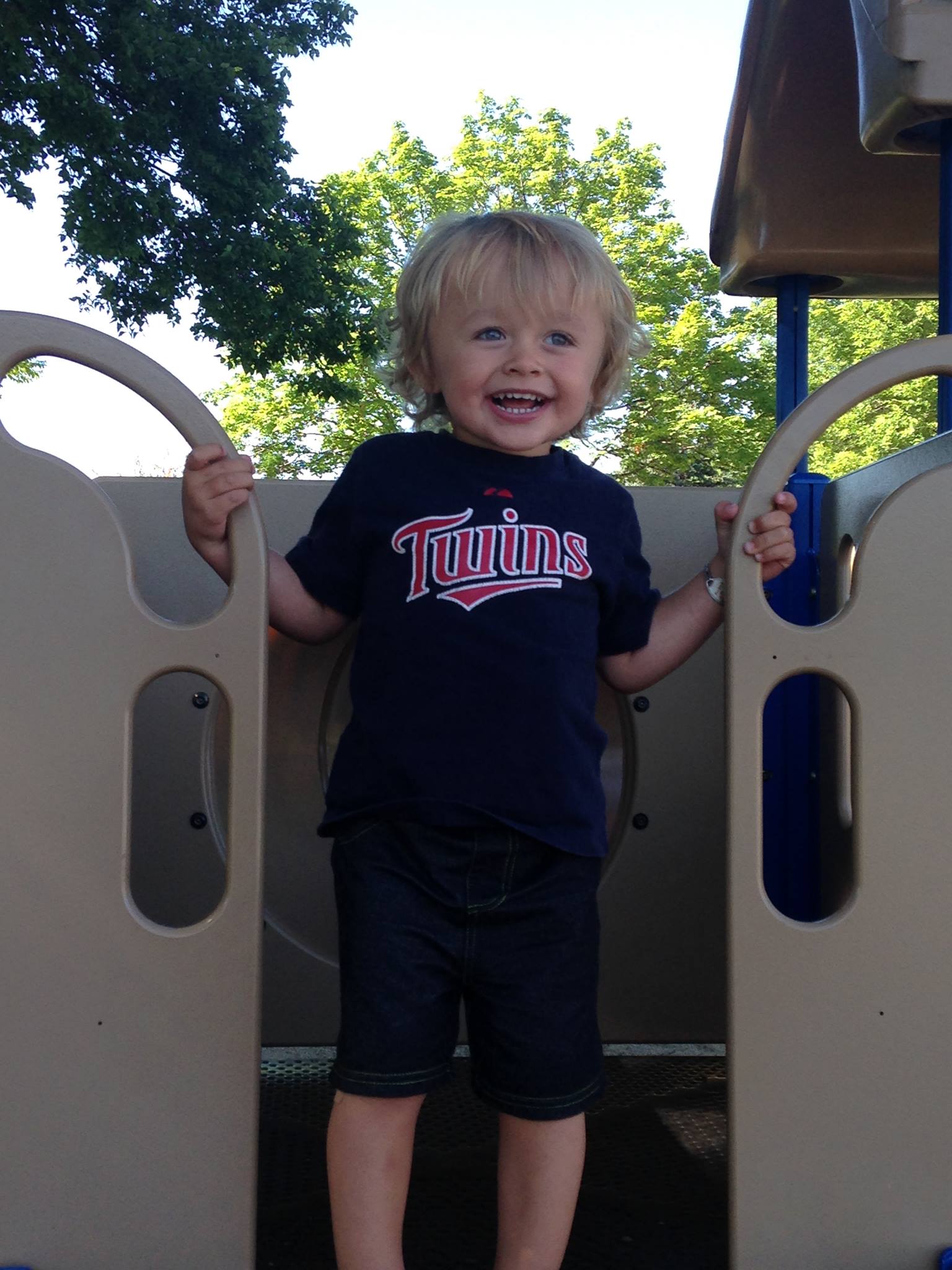 A young boy on the playground. 