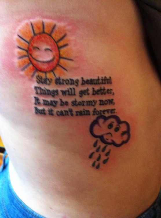 A tattoo of illustrations of a happy sun and sad rain cloud with the word, "Stay strong beautiful. Things will get better, It may be stormy now, but it can't rain forever"