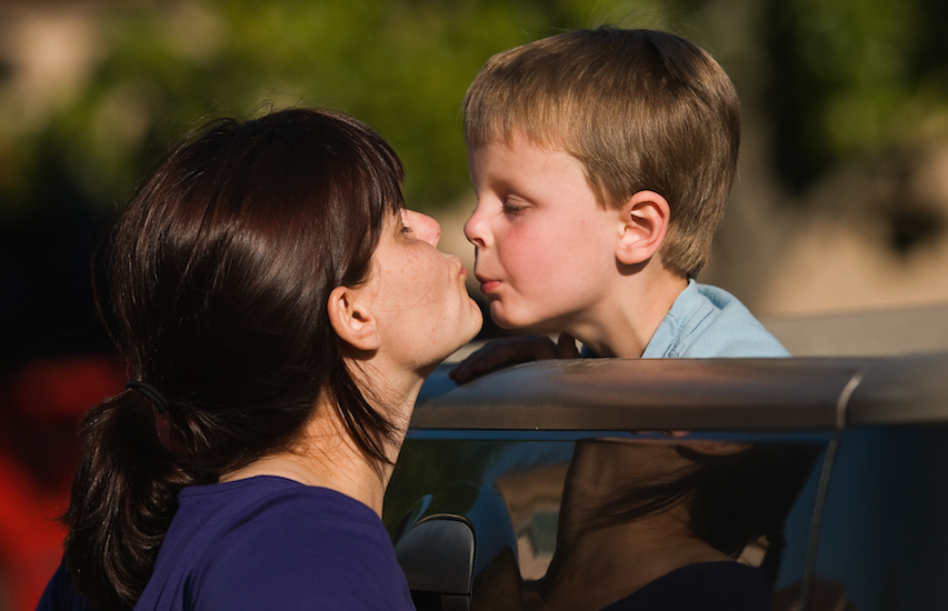 mom about to kiss son