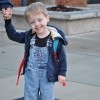 two photos of little boy outside