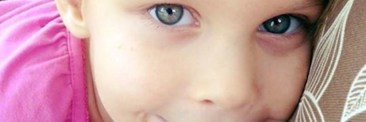 Letter to People Who Know a Child With PANDAS Upclose photo of a young, blonde girl's smiling face