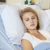 teenage girl in hospital bed