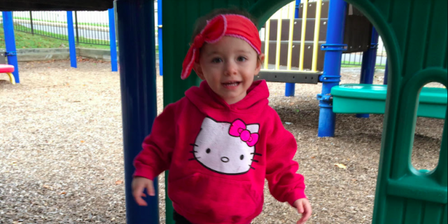 When Your Child Has Epilepsy, a Lot Can Happen in 30 Seconds... or Less Contributor's young daughter at smiling playground and wearing a pink Hello Kitty shirt