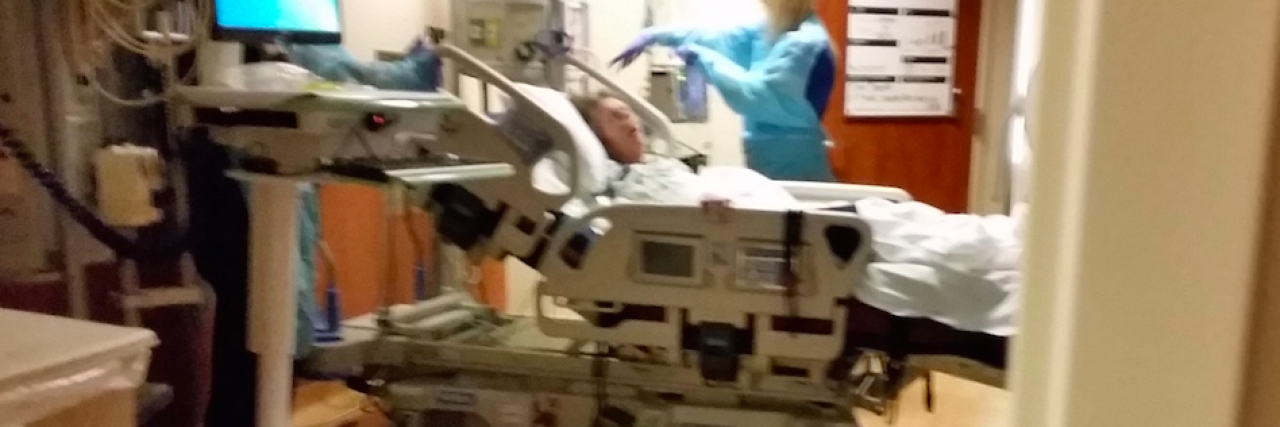 To My Mom as I Sit Beside Her Hospital Bed Woman in hospital bed with nurse attending to her