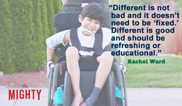 Happy little disabled boy outdoors in wheelchair