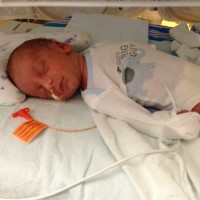 baby in the NICU with tubes, sleeping