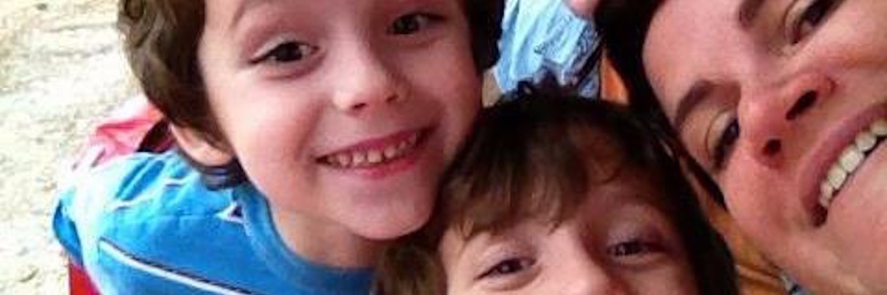 What I Know for Sure About Raising a Child With Autism parents and two sons smiling