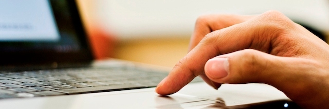 Staying Connected Through Social Media as a Special Needs Parent finger scrolling on a trackpad