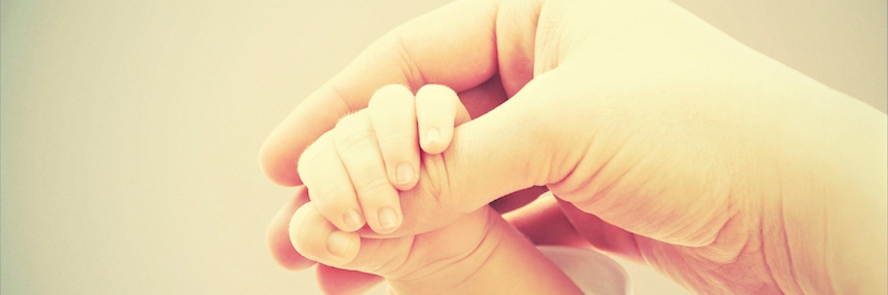 hands of mother and baby