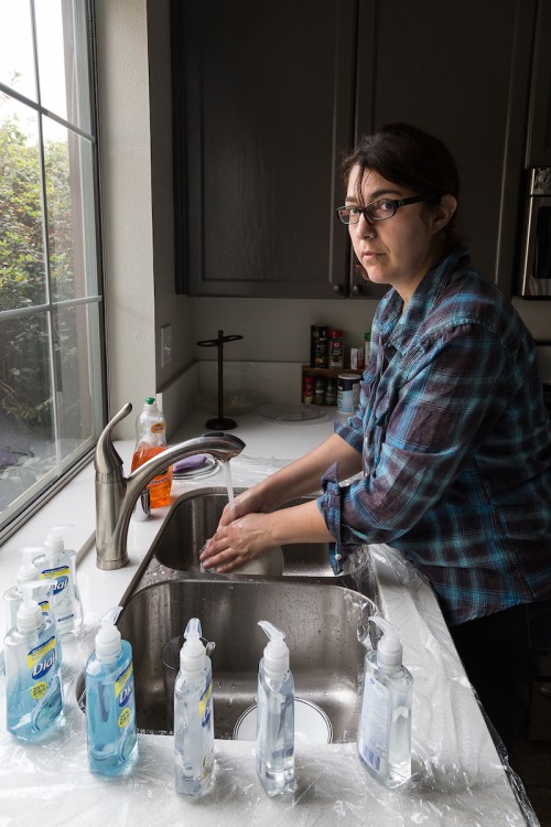 Woman with OCD washing her hands