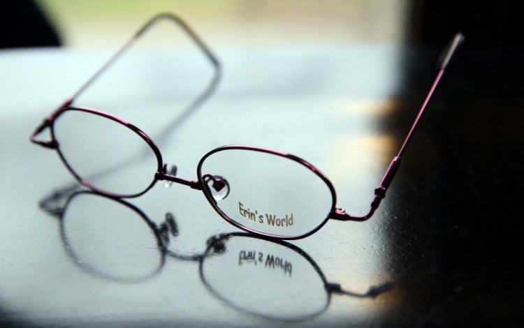 A pair of Erin's World glasses, by Specs4us, designed by Maria Dellapina