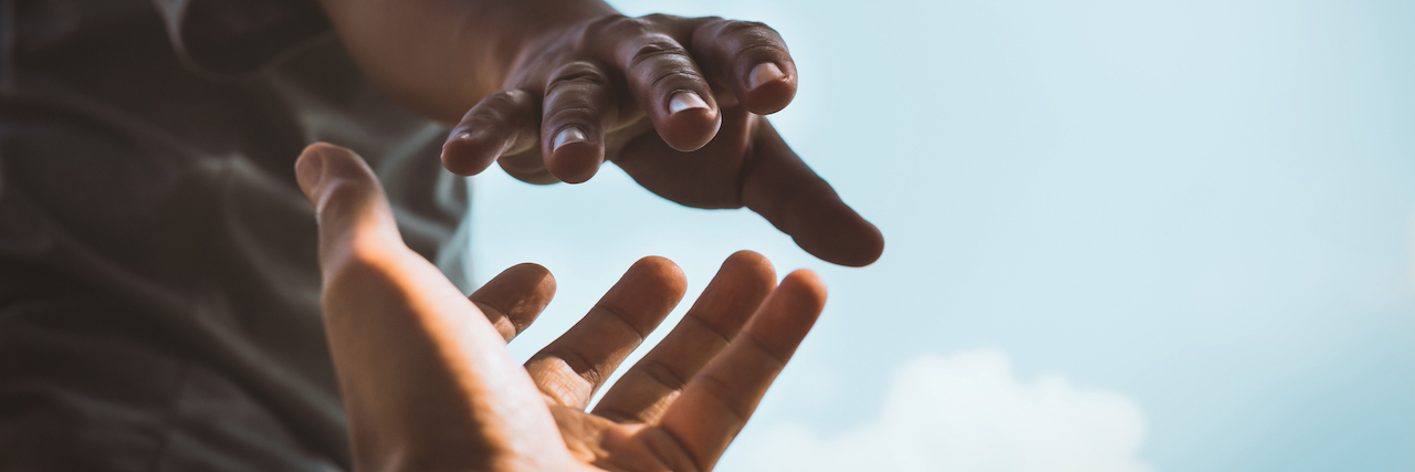 How to Help a Loved One With Postural Orthostatic Tachycardia Syndrome Cropped hands reaching out to help each other against sky