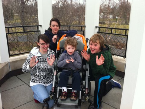 Mary Ann and her three younger siblings in a gazebo