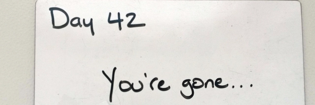 What to Consider If You're Experiencing a Miscarriage ultrasound photo taped to board