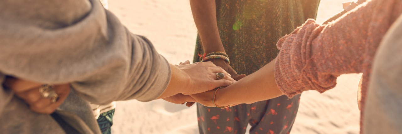 Thank You to Those Who Never Left While I Face Mental Illness Group of friends stack their hands together