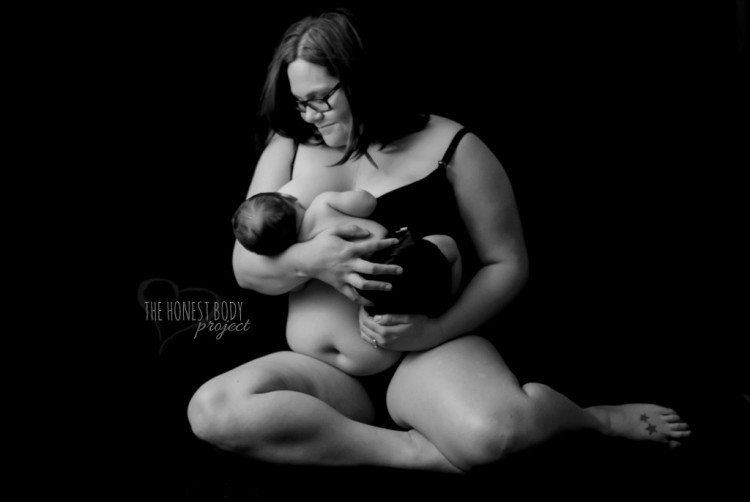 Woman with glasses holds her young son