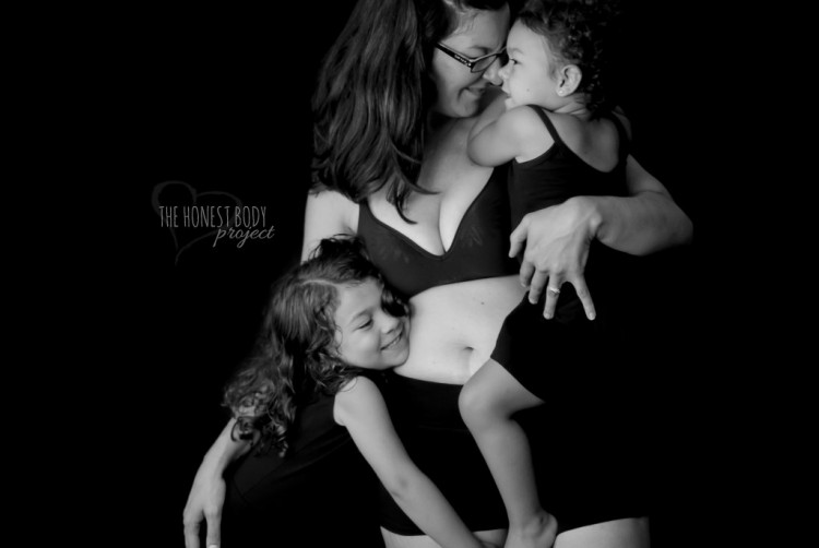 Mother smiling while holding her children