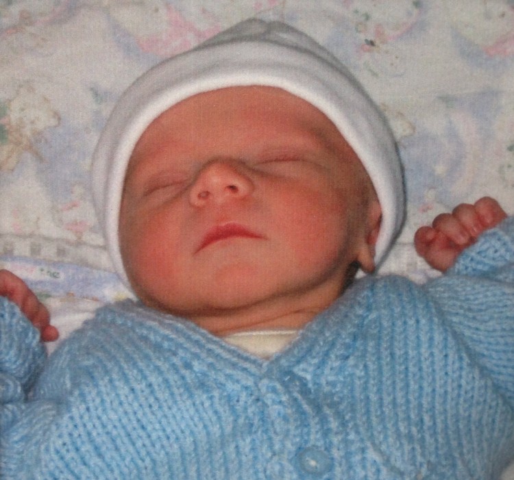 newborn baby wearing hat