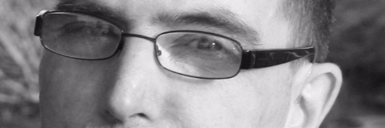 Life When You’re Born Without a Thyroid Gland black and white photo of man with glasses