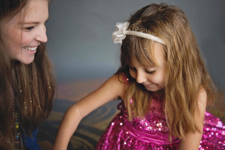 Mom with toddler daughter in pink dress