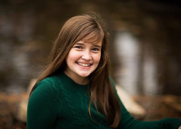 girl wearing green sweater