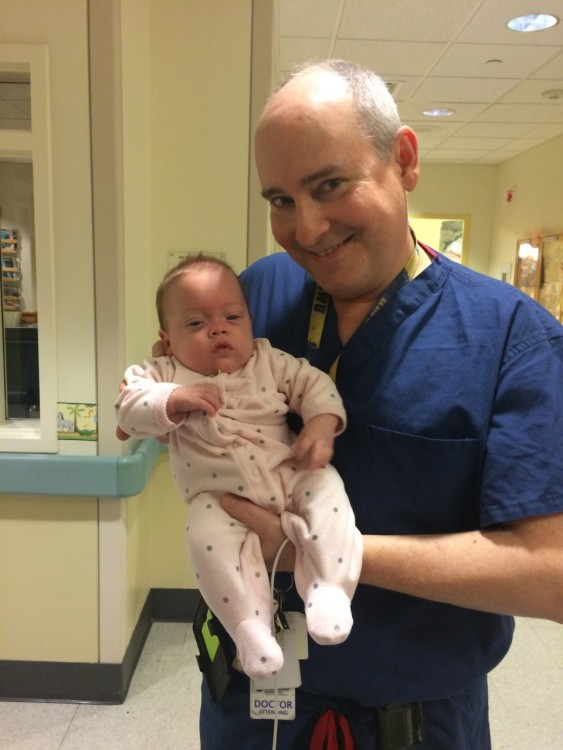 doctor holding baby in the hospital