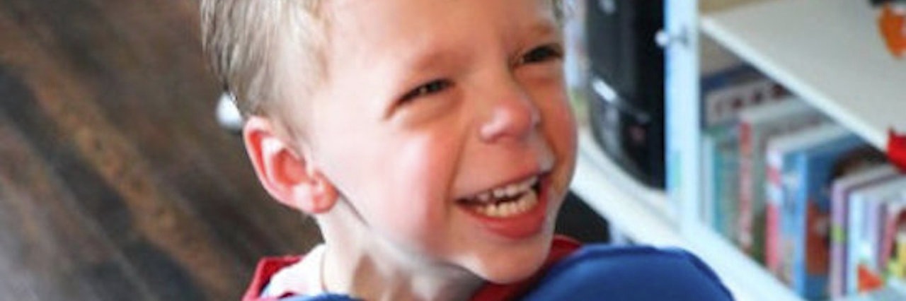 What Writing an IEP Taught Me About Special Needs Parenting boy wearing superman costume