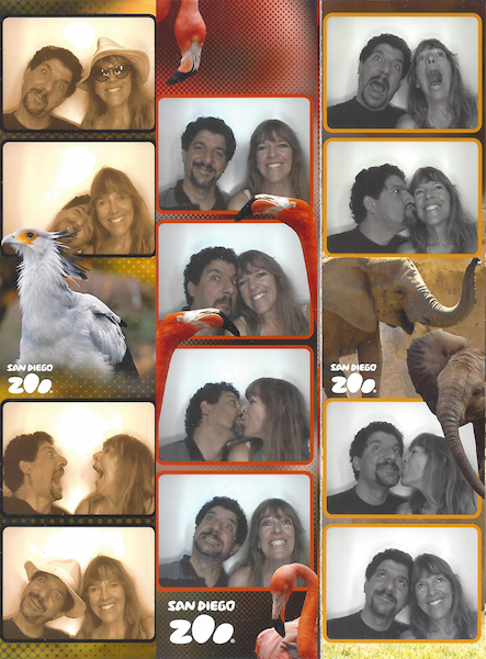 Rebecca and her husband make funny faces in a photo booth. 
